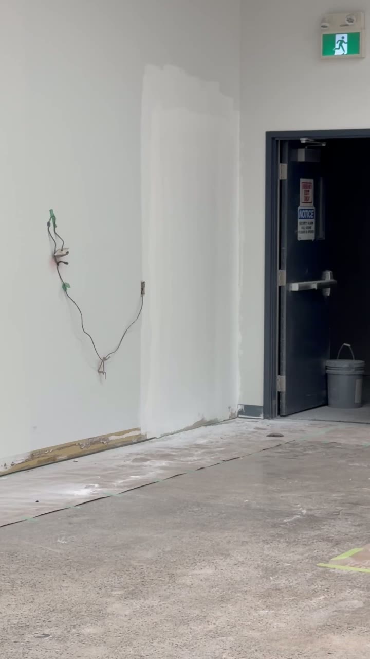 Drywall Patching at Exit Corridor